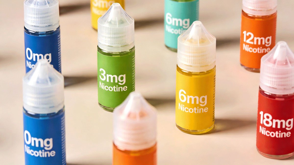 Various colorful vape juice bottles showing different nicotine strengths